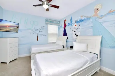 a bedroom with two beds and a disney mural at Amazing Home With Theme Rooms, Game Rooms Near Disney With Waterpark & Resort Access At Encore Resort - 7647Wl in Kissimmee