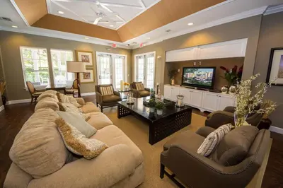 a living room with a large couch and a television at HAPPY PORT, your home very close to entertainment in Kissimmee