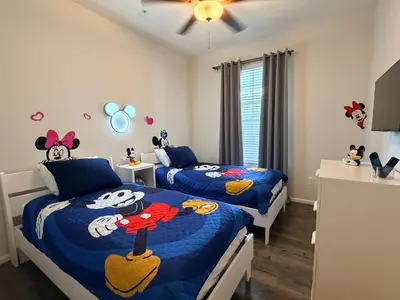 a bedroom with two beds with hello kitty beds at 210 Disney Universal Convention Center in Orlando
