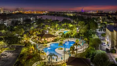 an aerial view of a resort with a pool at night at 210 Disney Universal Convention Center in Orlando
