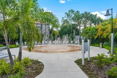 a fountain in a park with palm trees at 210 Disney Universal Convention Center in Orlando