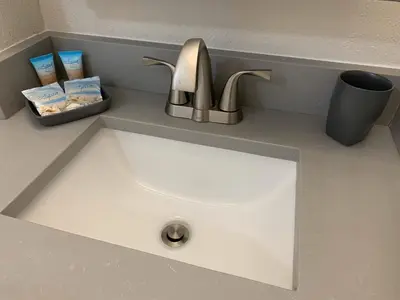 a sink with a faucet on a counter at 18-Universal and Heart of International Dr in Orlando
