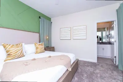 a bedroom with a large bed with a green ceiling at Stunning 5 Bd w/ Pool Close to Disney @ Storey Lake 2767 in Kissimmee