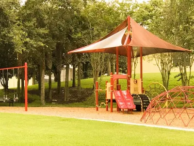 a playground with a tent and a swing set at 4 Bed And 3 Bath In Perfect Location With Pool By Florida Dream Home in Kissimmee