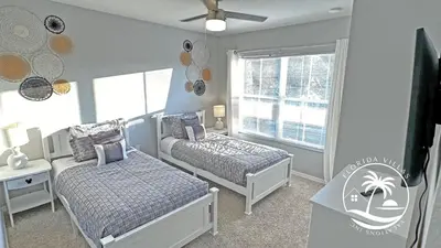 a small bedroom with two beds and a window at Villas at Seven Dwarfs - Close to Disney in Kissimmee