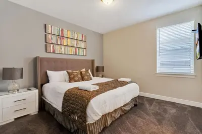 a bedroom with a bed and a book shelf at 491 Lasso dr in Orlando