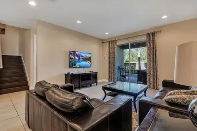 a living room with a couch and a table at 491 Lasso dr in Orlando