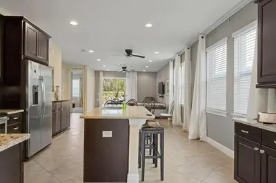 a large kitchen with a island in the middle at 551 Villa 8BD PoolSpa - Game room Movie room in Orlando