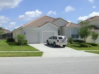 a white car parked in front of a house at bsv_villa7747 in Orlando