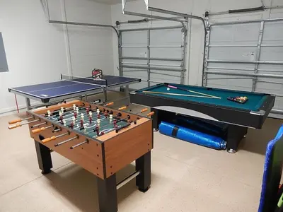 two ping pong tables sitting next to each other at bsv_villa7747 in Orlando