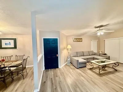 a living room with a couch and a table at Grand Holiday 3BR Palms Condo near Disney Parks in Kissimmee
