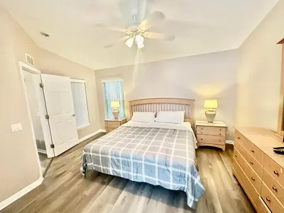 a bedroom with a bed and a ceiling fan at Grand Holiday 3BR Palms Condo near Disney Parks in Kissimmee