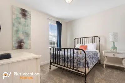 a bedroom with a bed and a window at 7541 Huge 8BD Home - POOLSpa - GameMovie room in Orlando