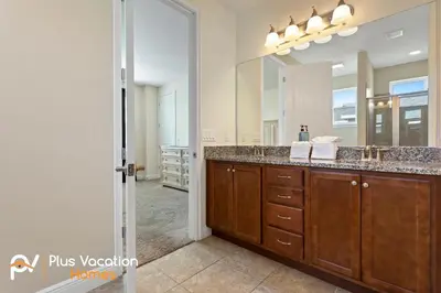 a bathroom with a sink and a mirror at 7541 Huge 8BD Home - POOLSpa - GameMovie room in Orlando