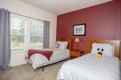 a bedroom with two beds with stuffed animals on them at 5370 INCREDIBLE 8 MINS TO DISNEY LUCAYA VILLAGE RESORT in Kissimmee