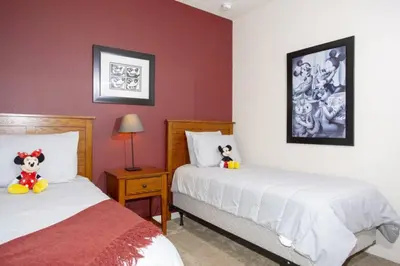a bedroom with two beds with stuffed animals on them at 5370 INCREDIBLE 8 MINS TO DISNEY LUCAYA VILLAGE RESORT in Kissimmee