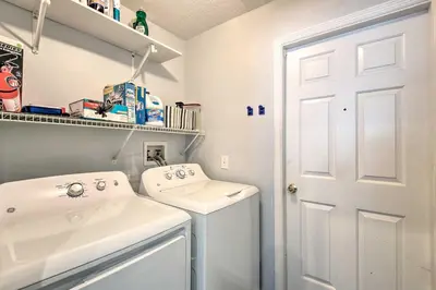 a white laundry room with a washer and dryer at Apopka Single-Story Home with Private Lanai and Pool! in Orlando