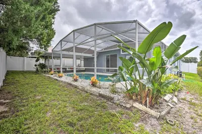 a house with a glass roof and a yard at Apopka Single-Story Home with Private Lanai and Pool! in Orlando
