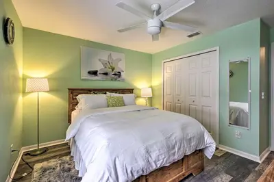 a bedroom with a bed and a ceiling fan at Apopka Single-Story Home with Private Lanai and Pool! in Orlando
