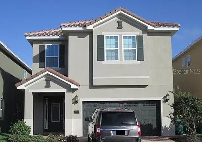 a car parked in front of a house at 7613-IBRAHIM · 7613 Paradise at Encore wiith Private pool in Orlando