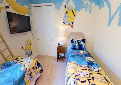 a childs bedroom with two beds and a tv at 7613-IBRAHIM · 7613 Paradise at Encore wiith Private pool in Orlando