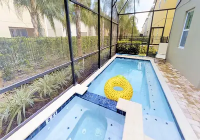 a swimming pool with a yellow float in a building at 7613-IBRAHIM · 7613 Paradise at Encore wiith Private pool in Orlando