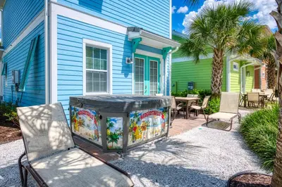 a blue house with a table and chairs in front of it at Happy Ours Cottage Near Disney With Private Hot Tub And Margaritaville Resort & Island H20 Waterpark Access - 3086Kl in Orlando
