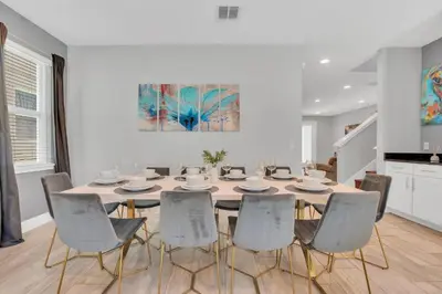 a dining room with a table and chairs at 650 Lasso Drive in Orlando