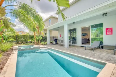 a swimming pool in front of a house at 650 Lasso Drive in Orlando
