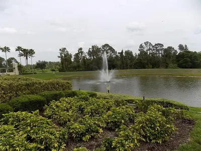 a fountain in the middle of a pond at Spring retreat near Disney, Perfect for families in Kissimmee