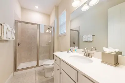 a bathroom with a shower and a sink and a toilet at Comfy Cottage With Hot Tub Near Disney With Margaritaville Resort & Island H2O Access - 8029Sb in Orlando
