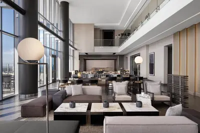 a rendering of a hotel lobby with couches and tables at AC Hotel by Marriott Orlando Downtown in Orlando