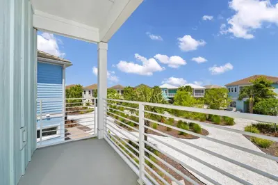 a balcony with a view of the ocean at Dreamy Cottage Near Disney With Margaritaville Resort & Island H2O Access - 8069Kd in Orlando