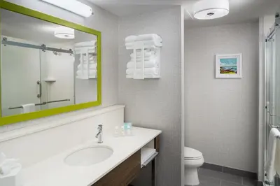 a bathroom with a sink and a toilet at Hampton Inn Kissimmee North in Kissimmee