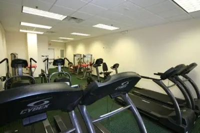 a gym with several cardio machines in a room at Luxury Resort Condo, 2 or 3 BR, Premium suites in Orlando