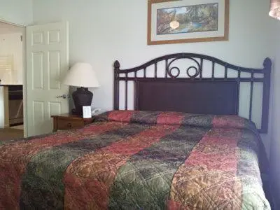 a bedroom with a bed with a quilt on it at Luxury Resort Condo, 2 or 3 BR, Premium suites in Orlando