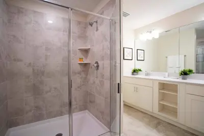 a bathroom with a shower and a sink at Luxurious 2 Bd Close to Disney @ Storey Lake 204P in Kissimmee