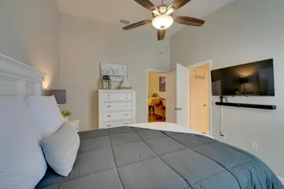 a bedroom with a bed with a ceiling fan at Pool, Themed Rooms and Arcade Disney Escape in Kissimmee