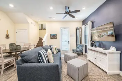 a living room with a couch and a table at Comfy Cottage Near Disney With Margaritaville Resort & Island H2O Access - 8087Kd in Orlando