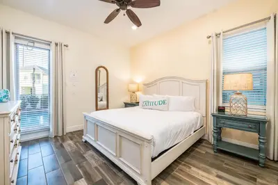 a bedroom with a bed and a ceiling fan at Brilliant Cottage With Private Pool Near Disney With Margaritaville Island H2O Access - 8033St in Orlando