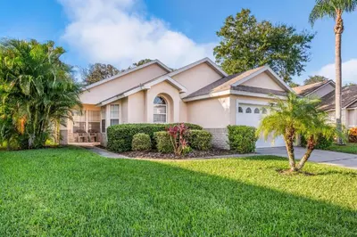 a house with palm trees in front of it at bsv_villa1607 in Orlando