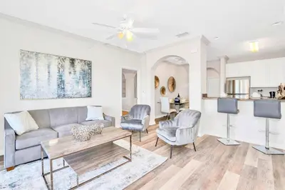 a living room with a couch and chairs and a table at Luxury 3BR Near Disney - Pool in Orlando
