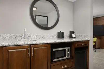 a bathroom with a sink and a microwave at Hampton Inn & Suites Orlando North Altamonte Springs in Orlando