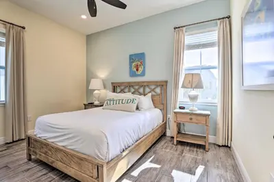 a bedroom with a bed and a window at Home with Hot Tub 4 Mi to Disney! in Orlando