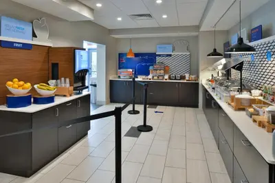 a store with fruits and vegetables on the counters at Holiday Inn Express Orlando - South Park by IHG in Orlando