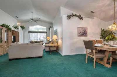 a living room with a couch and a table at Indian Ridge - 4 Bedroom Pool Home- 2408Ir in Orlando