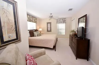 a bedroom with a bed and a tv in a room at Paradise Palms -5 Bed Townhome W-Splashpool-3046Pp in Kissimmee