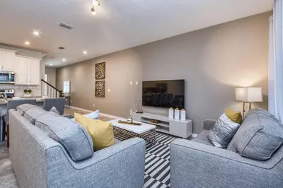 a living room with two couches and a tv at 5 Bedrooms Townhome W- Splashpool - 8205Sa in Orlando