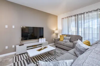 a living room with a couch and a tv at 5 Bedrooms Townhome W- Splashpool - 8205Sa in Orlando