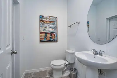 a bathroom with a toilet and a sink and a mirror at 5 Bedrooms Townhome W- Splashpool - 8205Sa in Orlando
